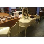 A cream Marion Antionette style dressing table and headboard