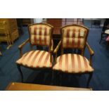 A pair of open armchairs