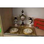 Pair of gilt framed relief plaques and a garniture