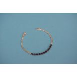 An 18ct white gold bracelet set with 11 sapphires,