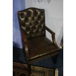 A good pair of brown leather button back Chesterfield armchairs