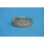 An 18ct gold diamond 1/2 hoop eternity ring (cost