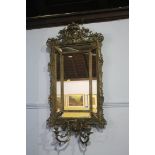 A pair of gilded decorative mirrors