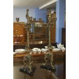 Pair of ornate brass candelabra