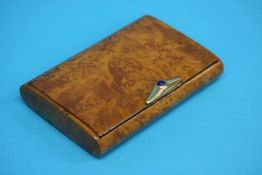 A Masur Birch Russian cigarette box, the gold mount with central blue stone cabachon, stamped 56.