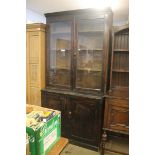 A pine glazed bookcase