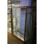 A glass fronted and glass side shop display cabinet. 91cm wide x 152cm height x 39cm depth