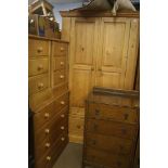 A pine double door wardrobe, a chest of drawers and a pair of bedside chests