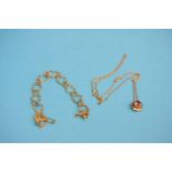 A 9ct gold heart shaped design bracelet, weight 2.9 grams and a 9ct gold pendant inset with a