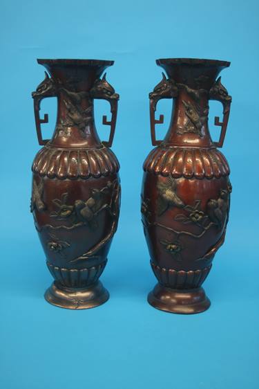 A pair of lacquered Oriental bronze type vases, de