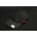 A Gucci cap (cost £150)