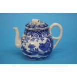An Oriental blue and white tea pot decorated with birds