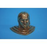 A small cast brass Indian head, 7cm height