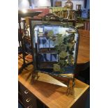 A brass and painted glass fire screen and another screen