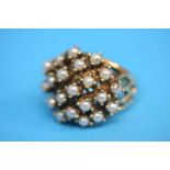 A 14ct gold ring, set with a cluster of 21 seed pearls