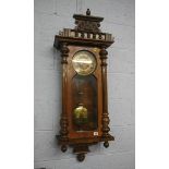 A walnut cased wall clock