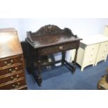 A carved oak single drawer side table. 89cm wide