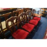 A set of four mahogany dining chairs