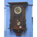 A mahogany wall clock