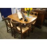 A good quality oak 'Lees' style dining room suite comprising; extending table, four chairs and