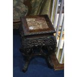 A Chinese carved hardwood pedestal table, inset with marble