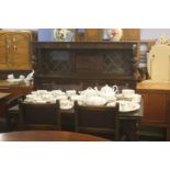 An oak six piece dining room suite comprising; extending table, four chairs and dresser