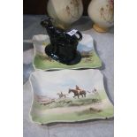 Staffordshire cow creamer and two Royal Doulton pl