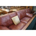 Two tan leather settees