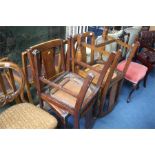 Two pairs of oak chairs