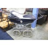 A silver cross pram