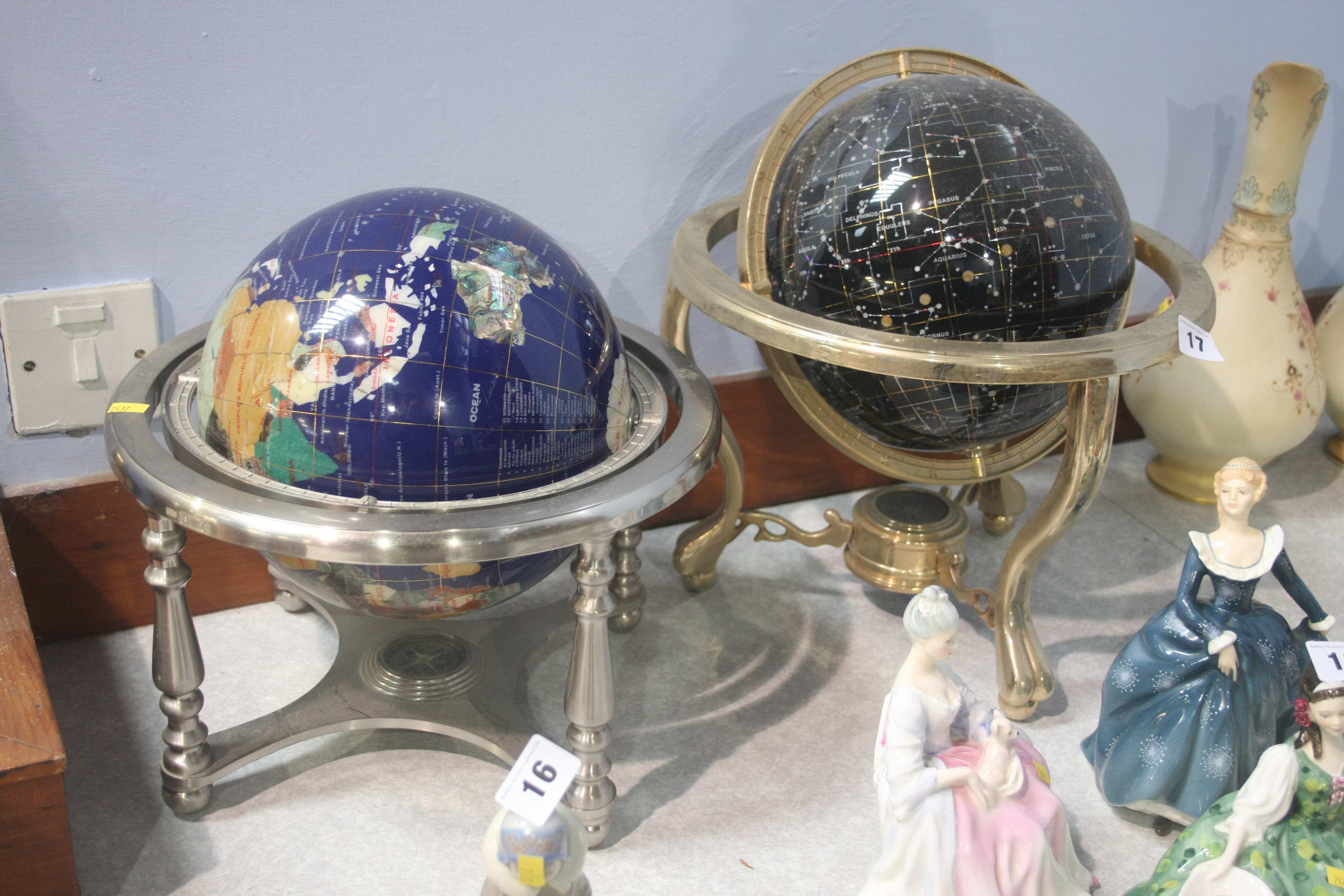 Two globes inset with semi precious stones