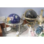 Two globes inset with semi precious stones