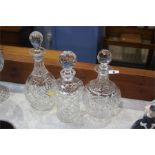 Three cut glass decanters