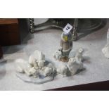 Two Lladro figure groups and three polar bears