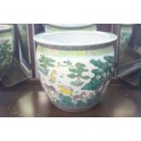 A large Oriental famille verte planter decorated wi