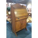 A narrow oak bureau