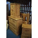 A pine chest of drawers and pair of pine bedside d