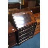 A reproduction mahogany bureau