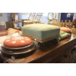 Three embroidered foot stools and a cushion