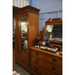 An Edwardian mirror door wardrobe and dressing chest