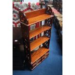 A reproduction mahogany hanging wall shelf