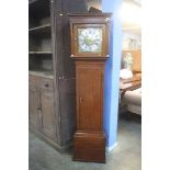 An oak long case clock with brass dial and silvere