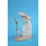 A boxed Lladro figure of a girl playing an flute