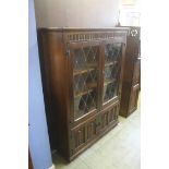 An oak leaded glass bookcase, 97cm wide