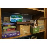 Shelf of board games, children's books etc.