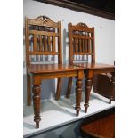 Pair of Edwardian oak hall chairs