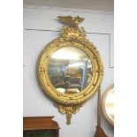 A Regency style gilt convex mirror 100cm height