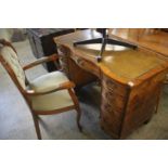 A reproduction mahogany pedestal desk and chair, 1