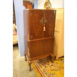 A walnut cocktail cabinet