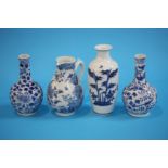 A pair of Chinese blue and white vases and one oth